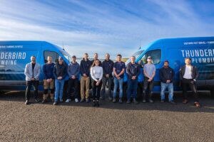 Thunderbird Plumbing Team Members and vans.
