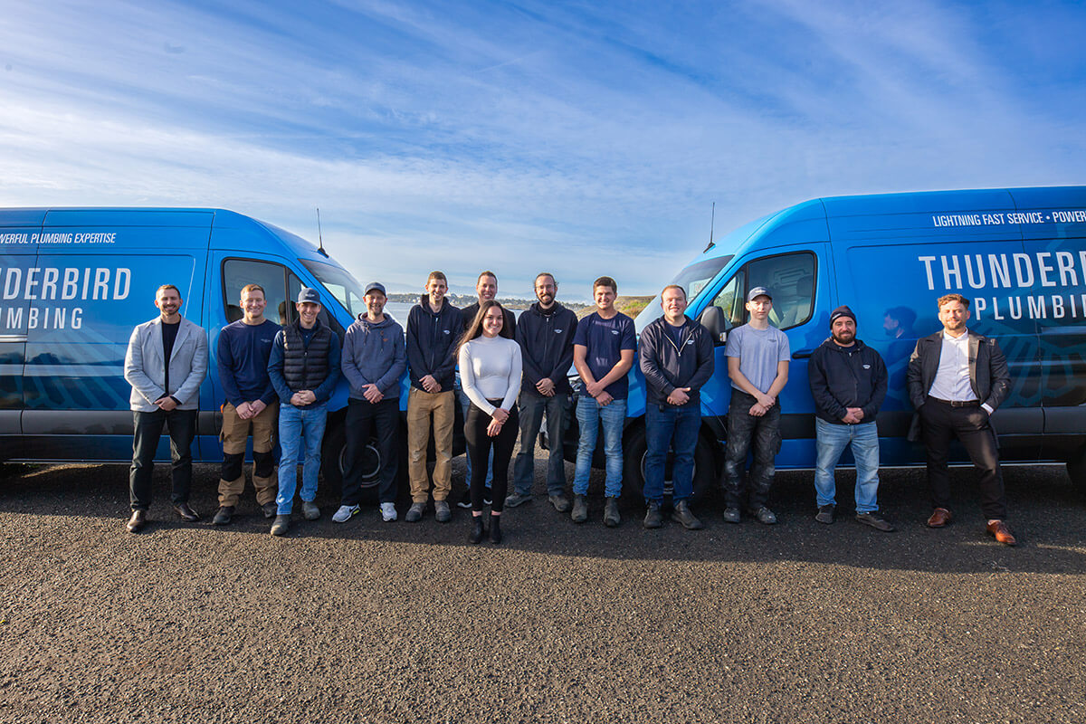 Thunderbird Plumbing Team Members and vans.